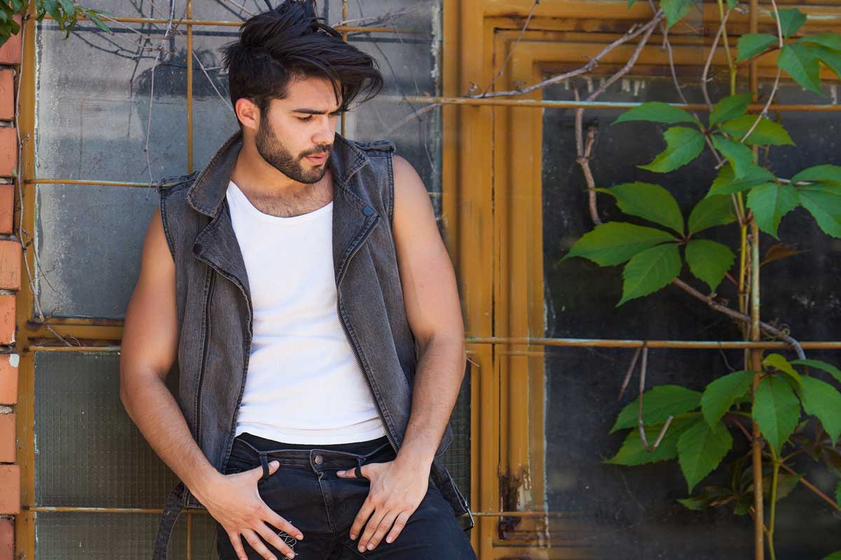 meadowfoam flower checking Two people inspecting meadowfoam flowers in a field to assess plant growth and seed quality